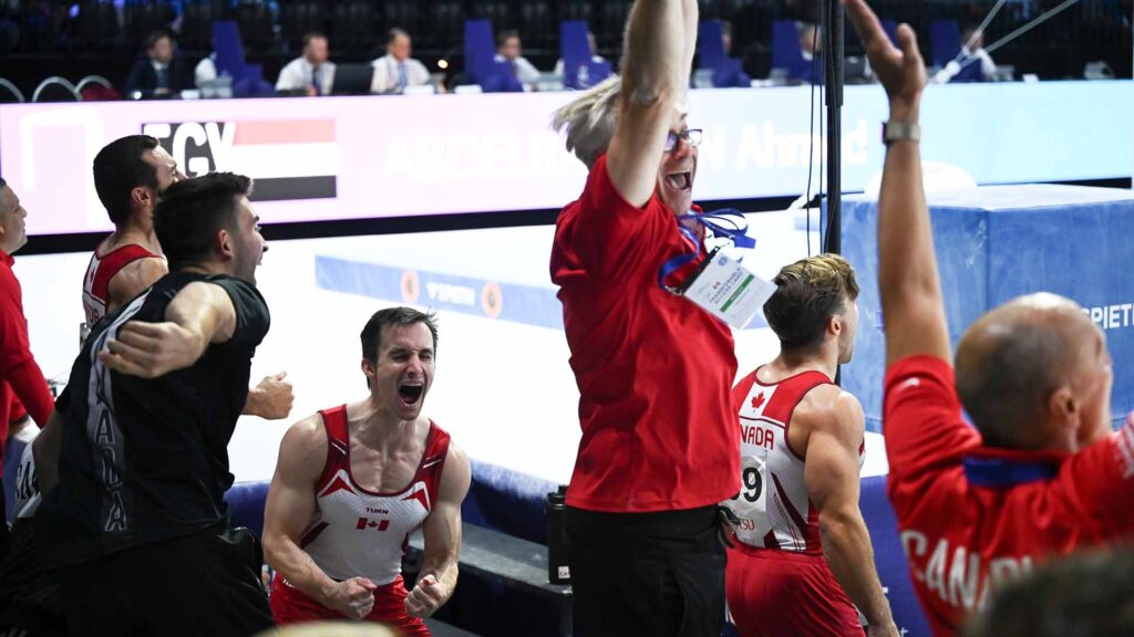 The Canadian men's gymnastics team celebrates at the 2023 Worlds in Antwerp