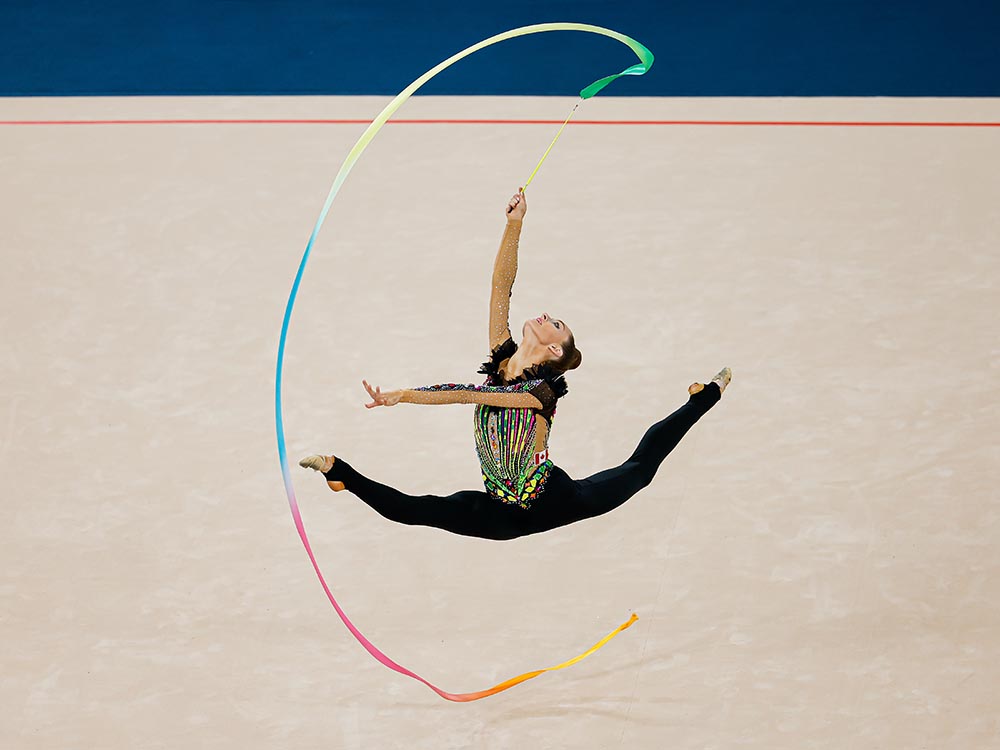 A female gymnast performs a ribbon routine