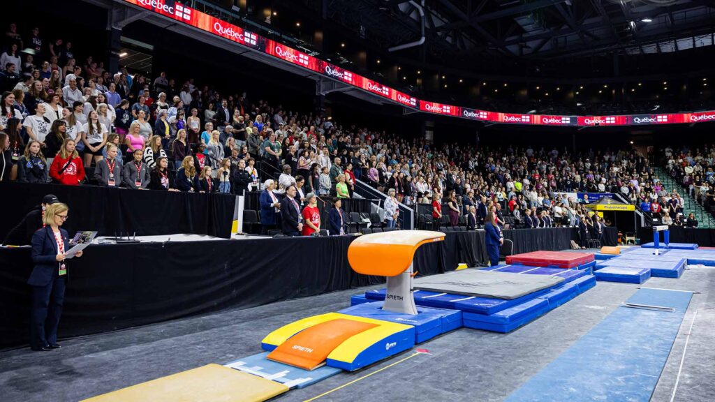 Vault on the floor in an arena full of fans