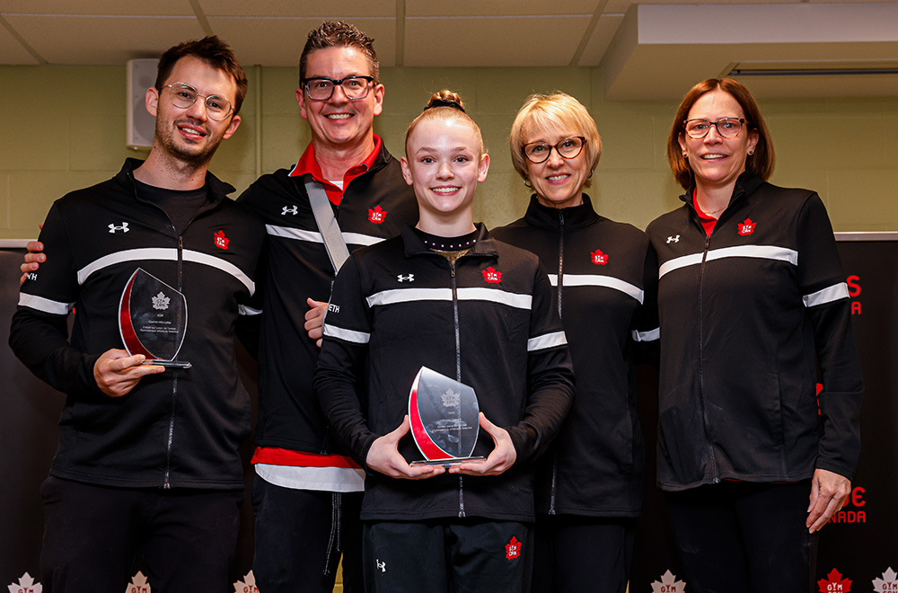 Junior athlete of the year Coralie Demers with coaches