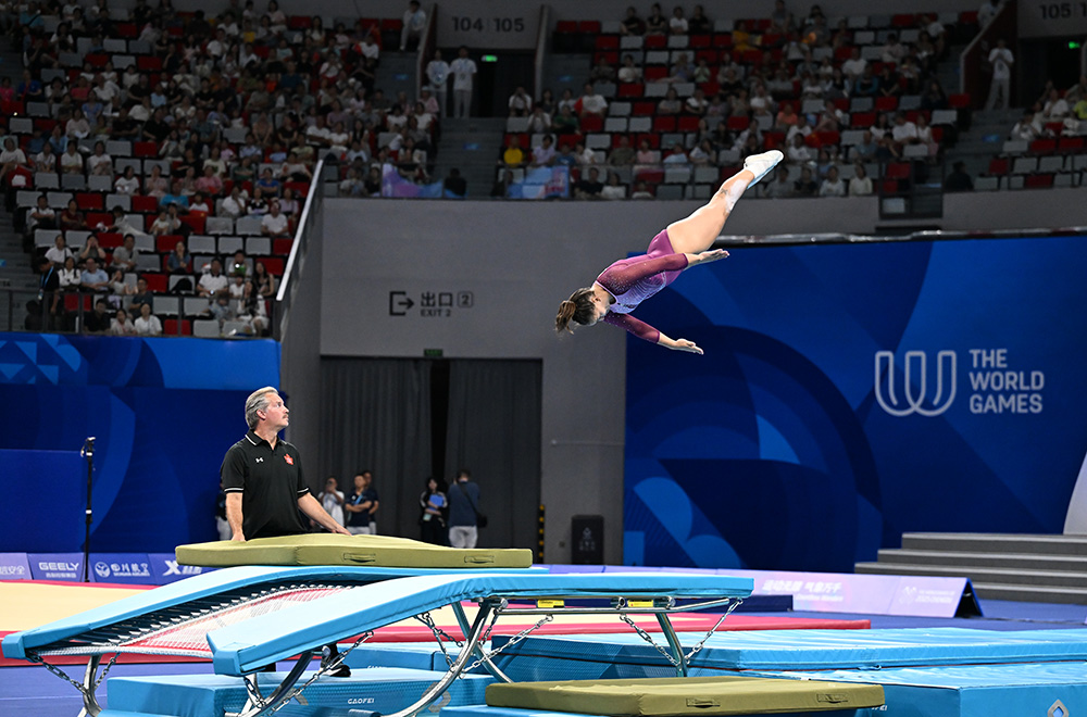 A female trampoline gymnast in mid-air